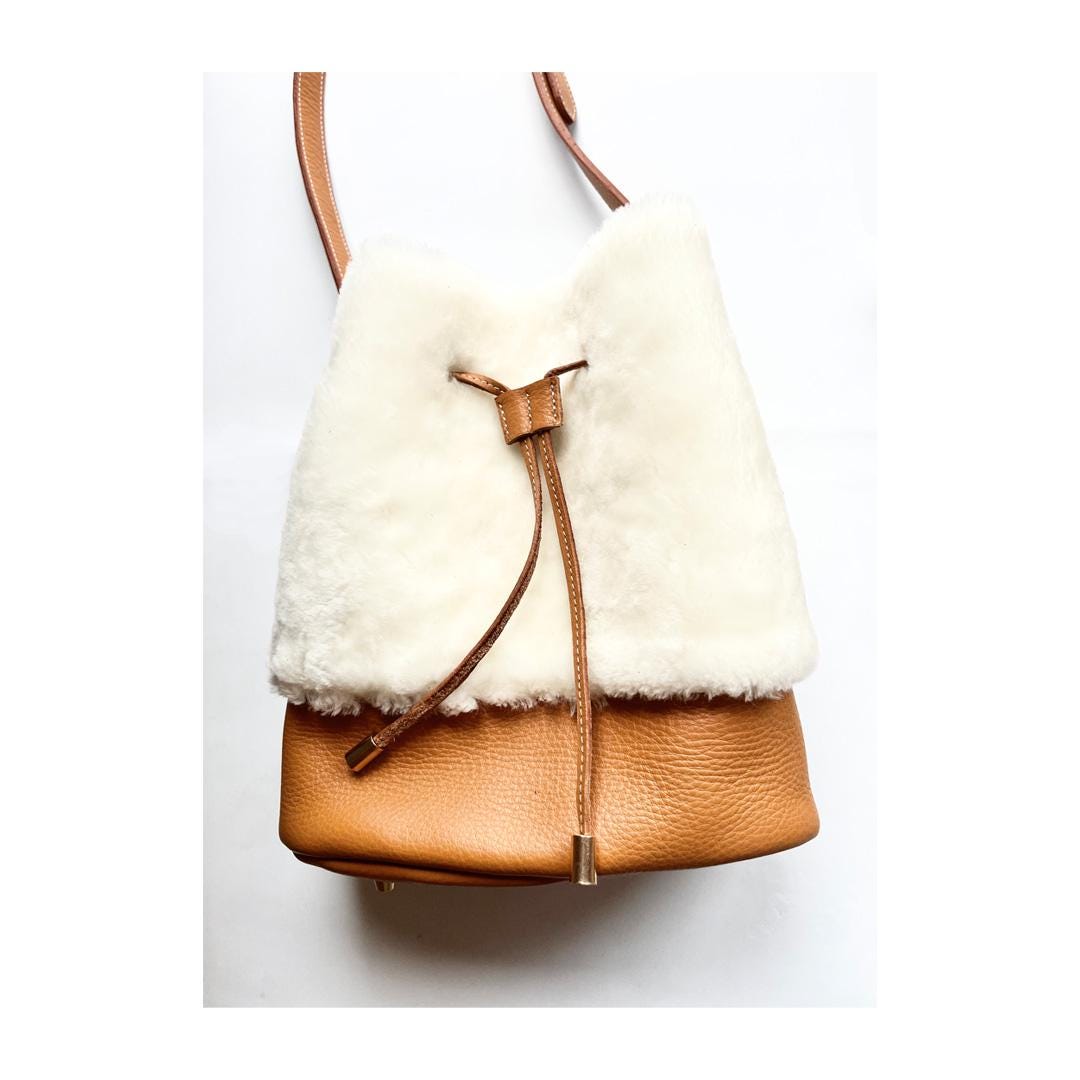 léonny cha Leather and Shearling Bucket Bag Elegance and Warmth