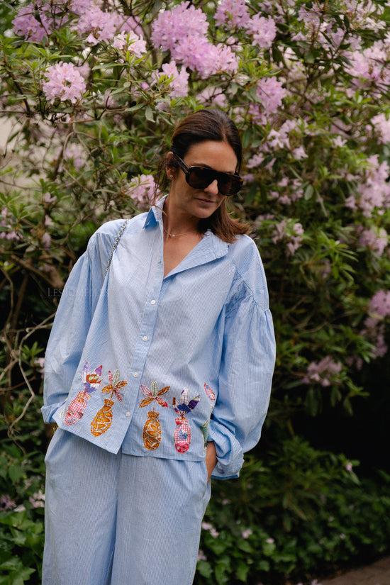 les jumelles Flora shirt blauwe strepen