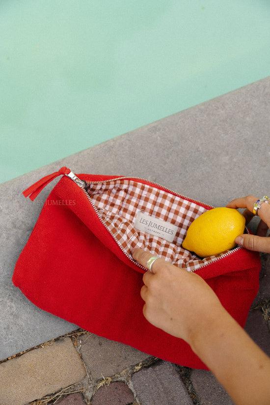 les jumelles Pia toilettas mandarijnrood