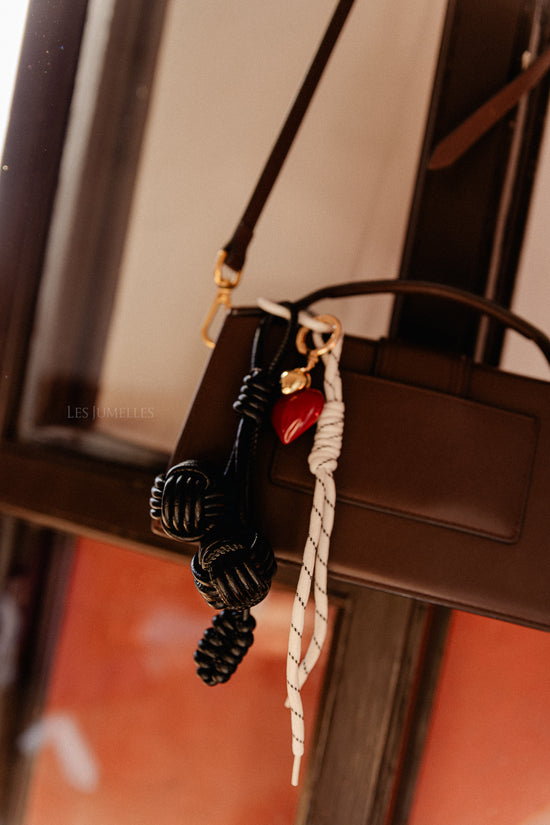 les jumelles Sleutelhanger leren ballen zwart/wit