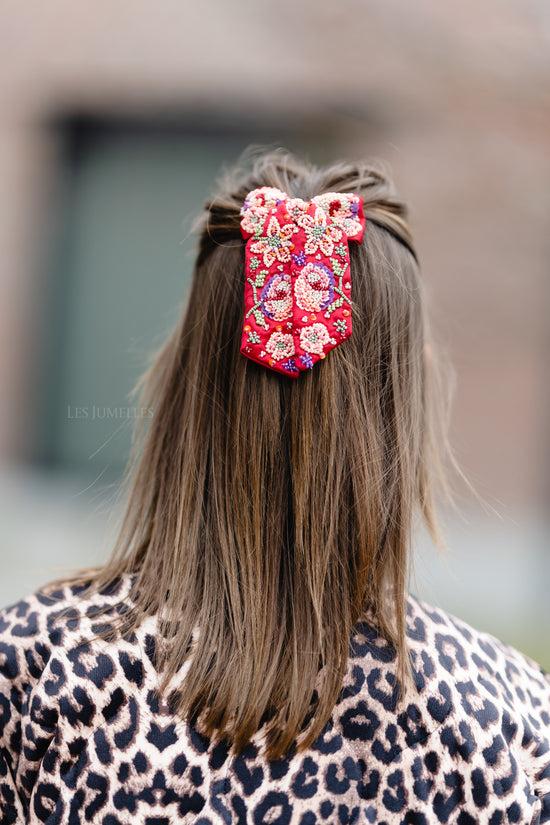 les jumelles Yvette strikclip met kralen rood