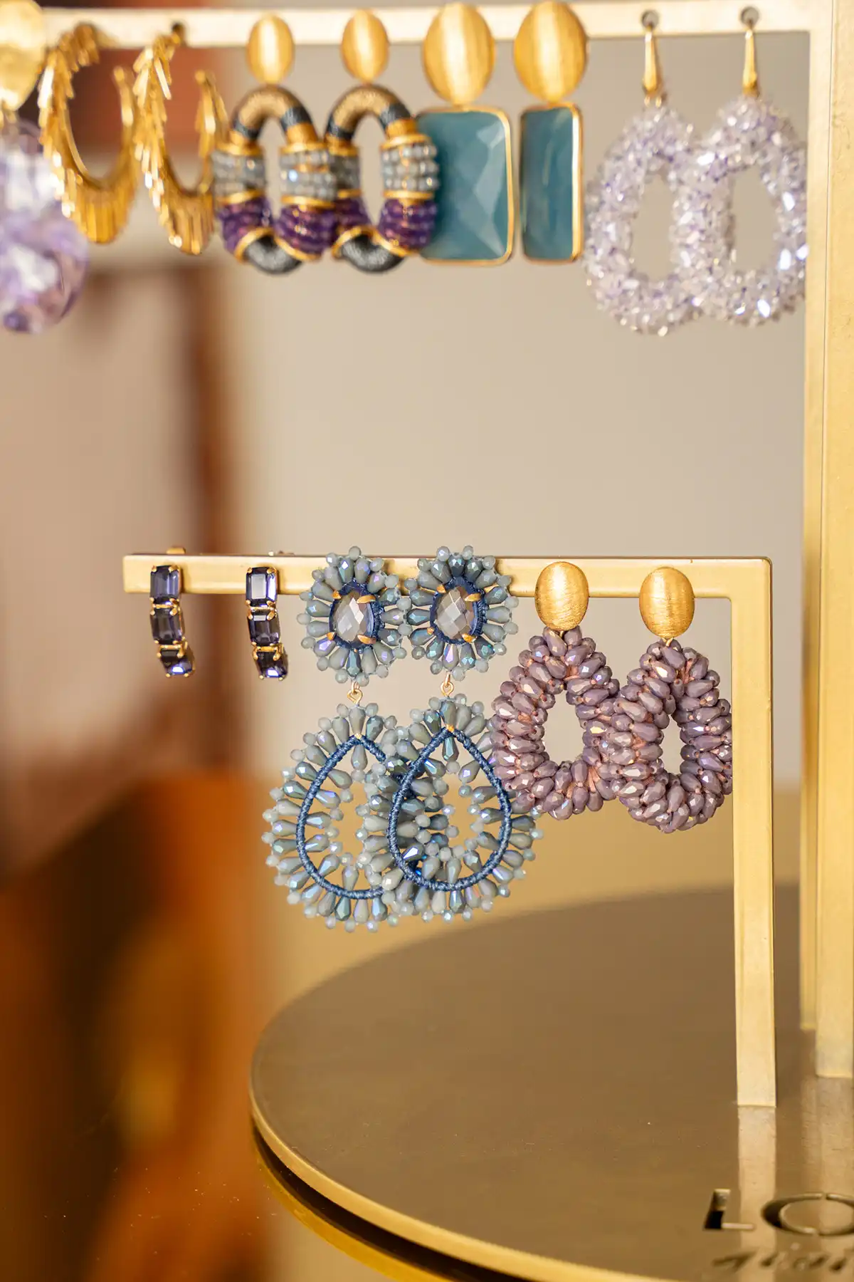 Lott. Gioielli Diep Paarse Triple Curved Oorbellen