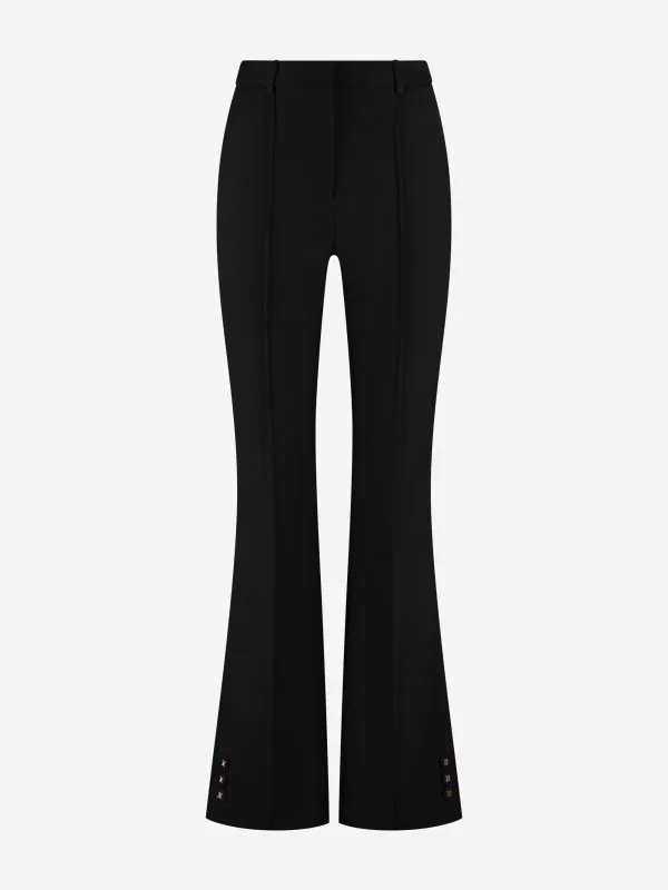 nikkie Aansluitende flared pantalon met naden en N-knopen