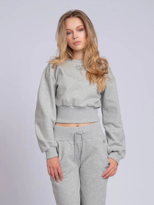 Nikkie Cropped Sweater Met Brede Elastische Tailleband