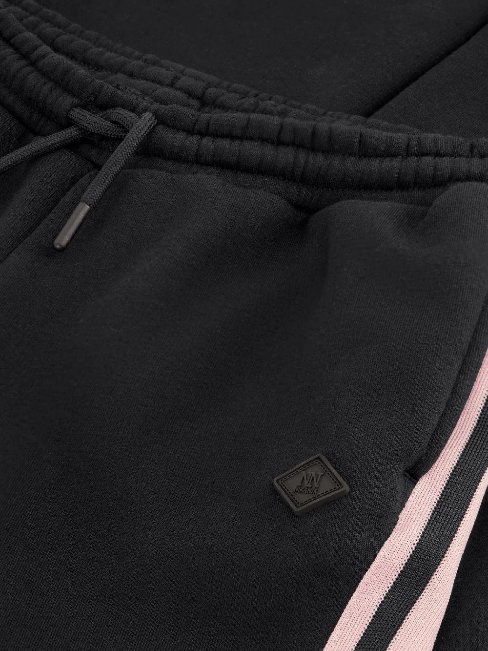 Nikkie Flared Joggingbroek Met Strepen Op Zijkanten