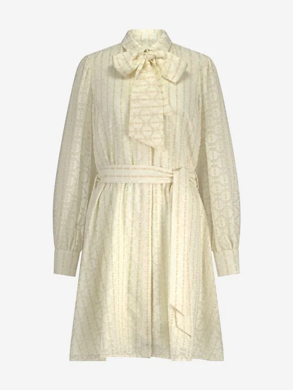 nikkie Losvallende jurk met ballonmouwen en een strikdetail