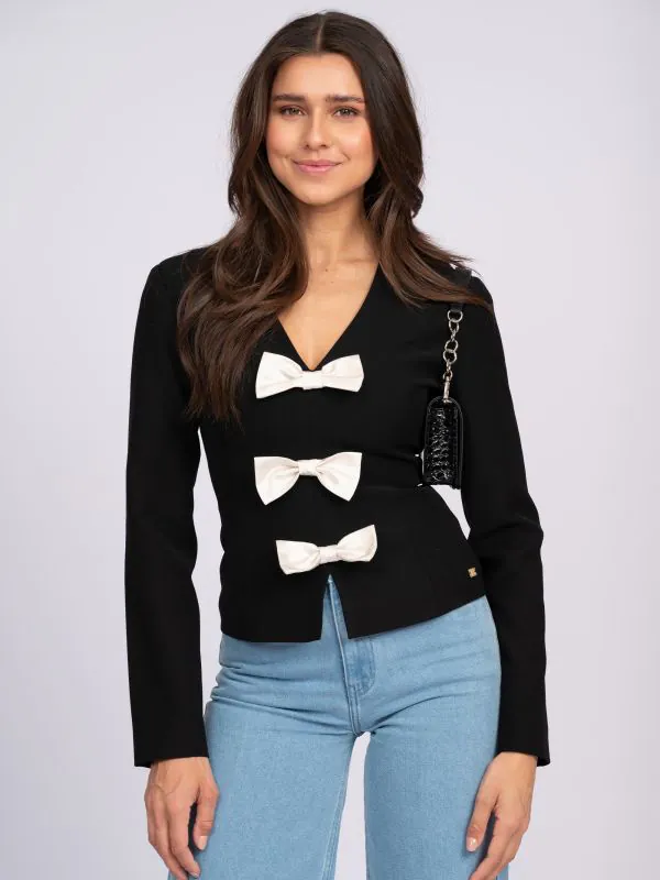 nikkie Aansluitende top met strikjes