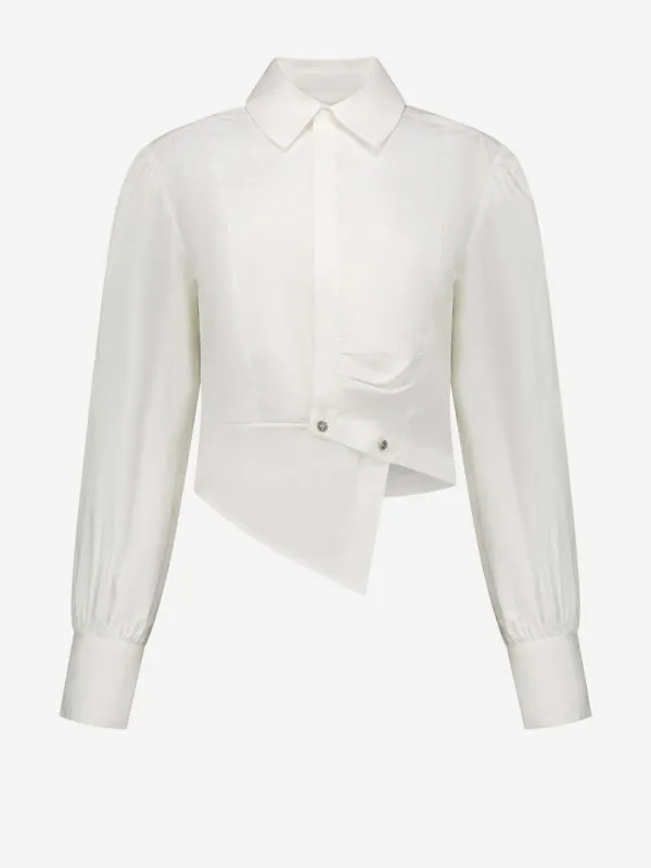 nikkie Korte asymmetrische blouse met ballonmouwen