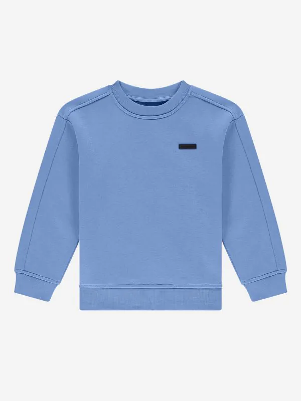 nikkie Sweater met geborduurde tekst op rug