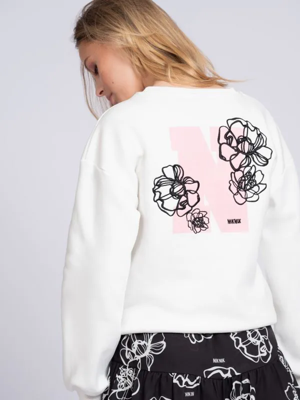 nikkie Sweater met grafisch logo en bloemenprint