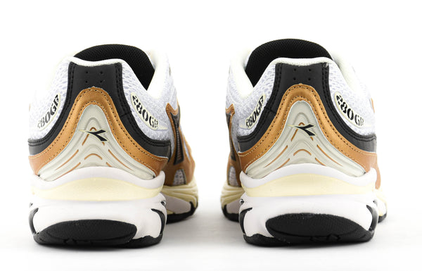 Paul Warmer DIADORA MYTHOS PROPULSION 280 WHITE BLACK GOLD