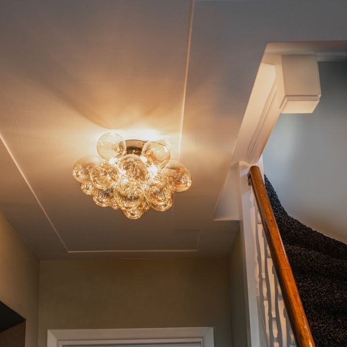 qazqa Design plafondlamp zwart met amber glas 4-lichts - Uvas