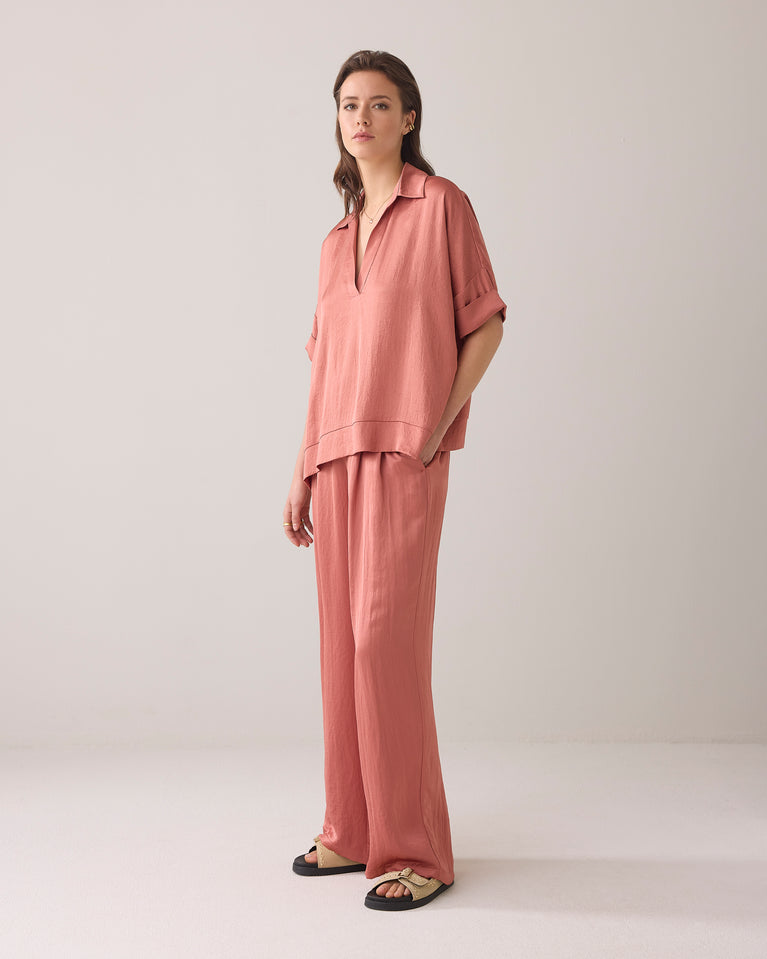 summum Glanzende top met V-split