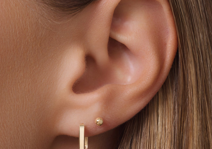 Tov Essentials Huggie U Hoops (12mm) 14 Karaat Goud